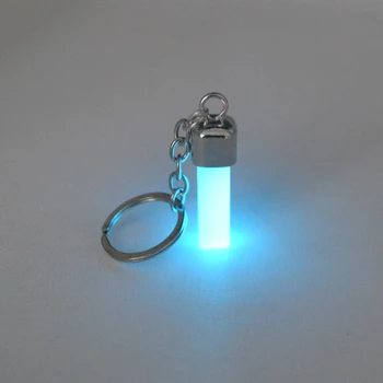Anahtarlık, hediyeler ile metal reçine, karanlıkta parlayan profesyonel ışık emici takı. Üretici toptan